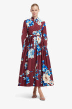 Woman wearing a floral dress with a white background