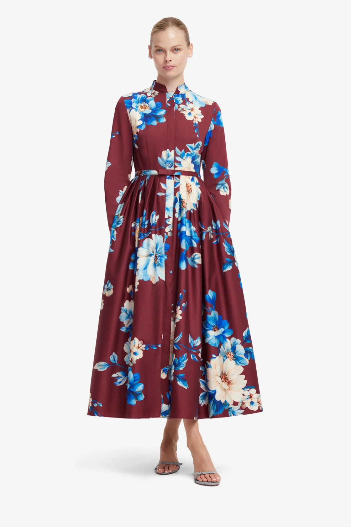 Woman wearing a floral dress with a white background