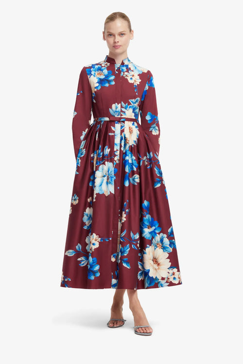 Woman wearing a floral dress with a white background