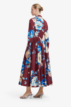 Woman wearing a floral dress with a white background