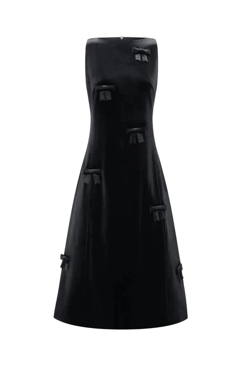 A black strapless midi dress with structured, boxy panel details and tassel-like accents, shown against a plain light gray background.