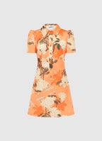A short-sleeved mini dress with a collared neckline and front button opening, featuring a tangerine orange color with a floral hydrangea print.