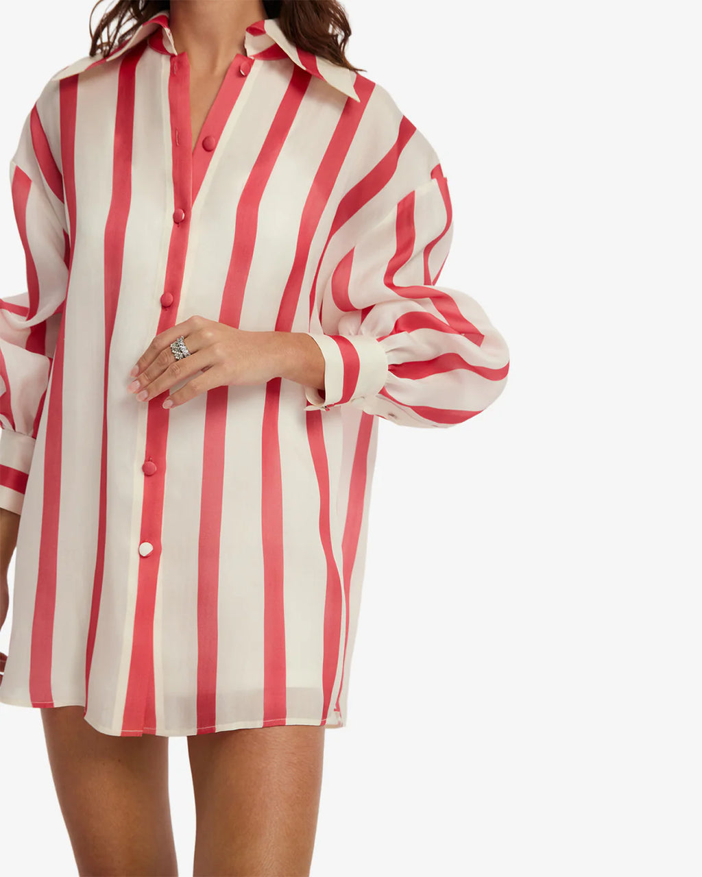 Red and white striped shirt worn by a person on a white background
