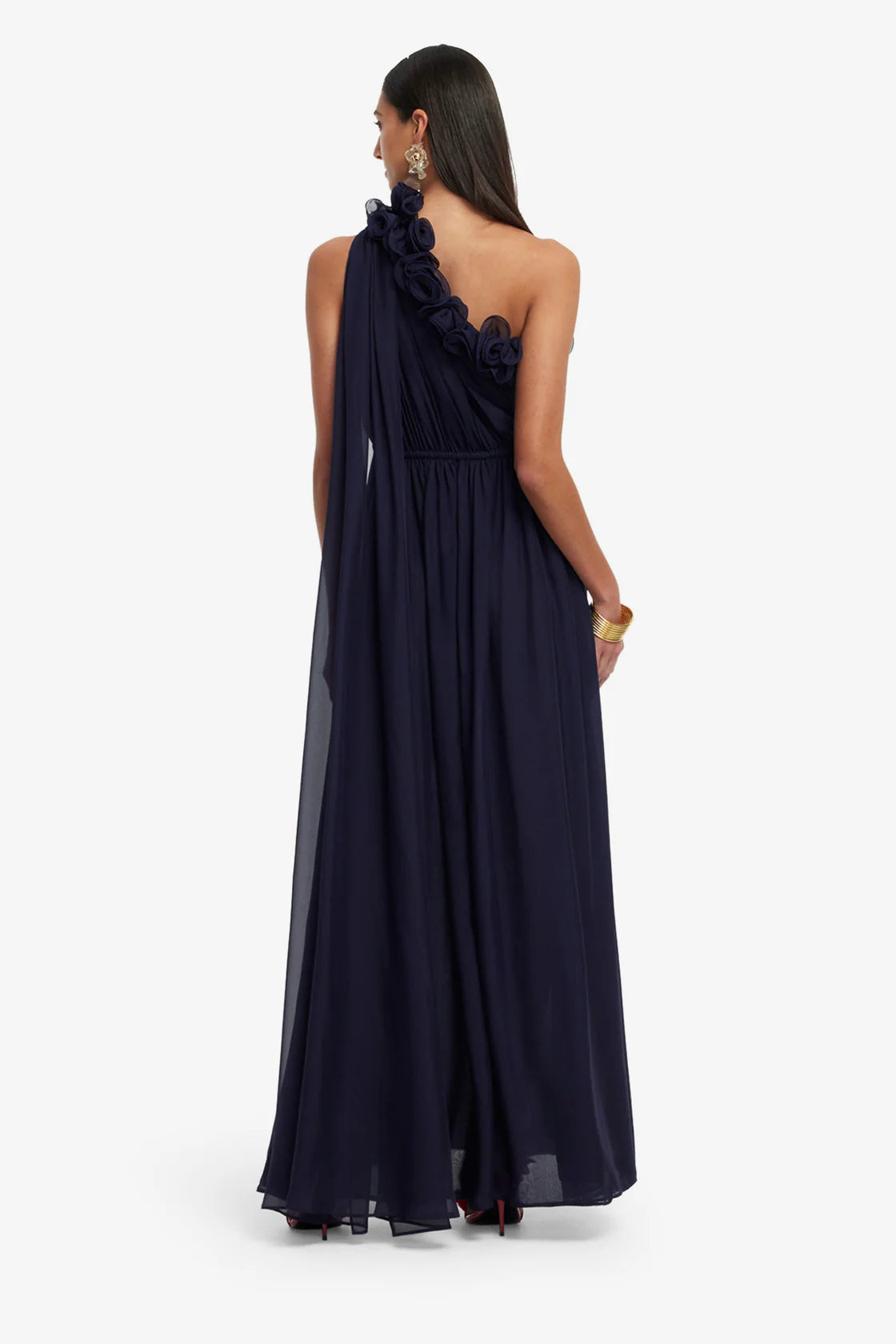 Navy one-shoulder dress worn by a model on a white background