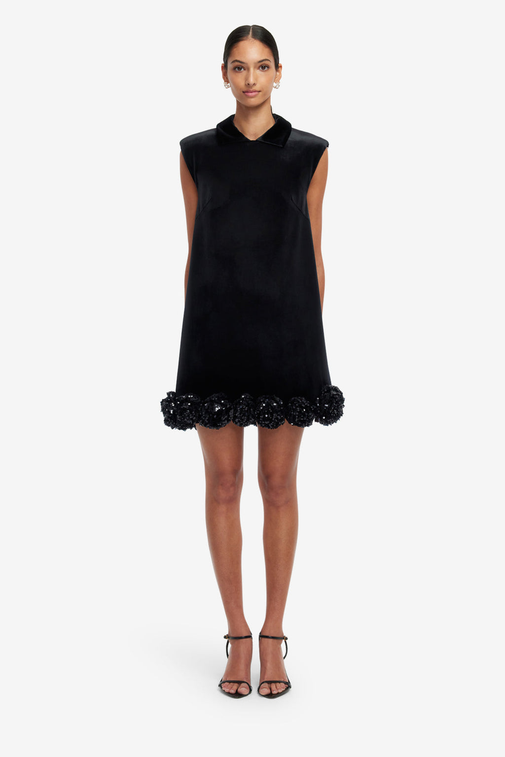 Black sleeveless dress with floral details on a white background