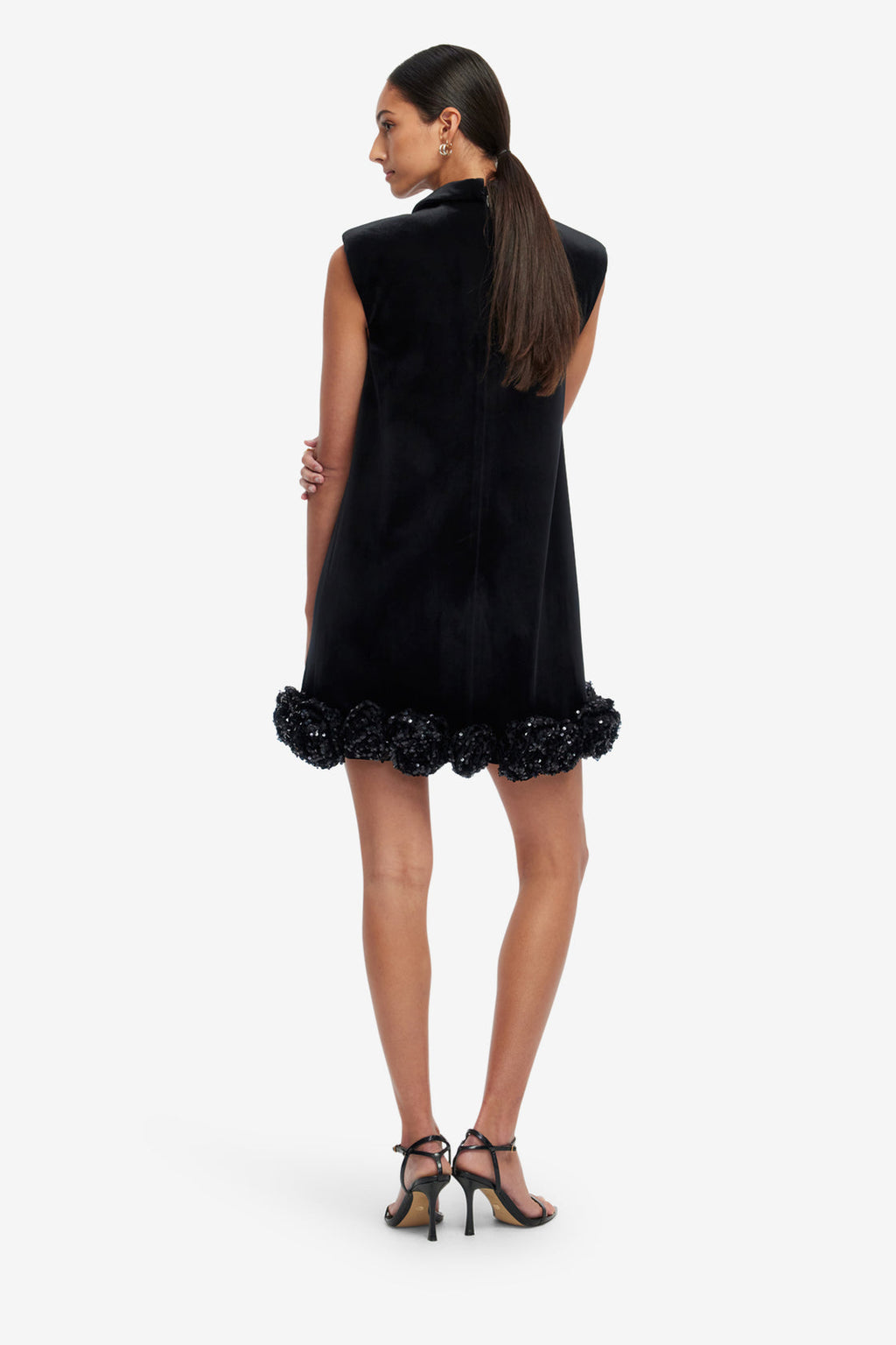 Black dress with floral details on a white background
