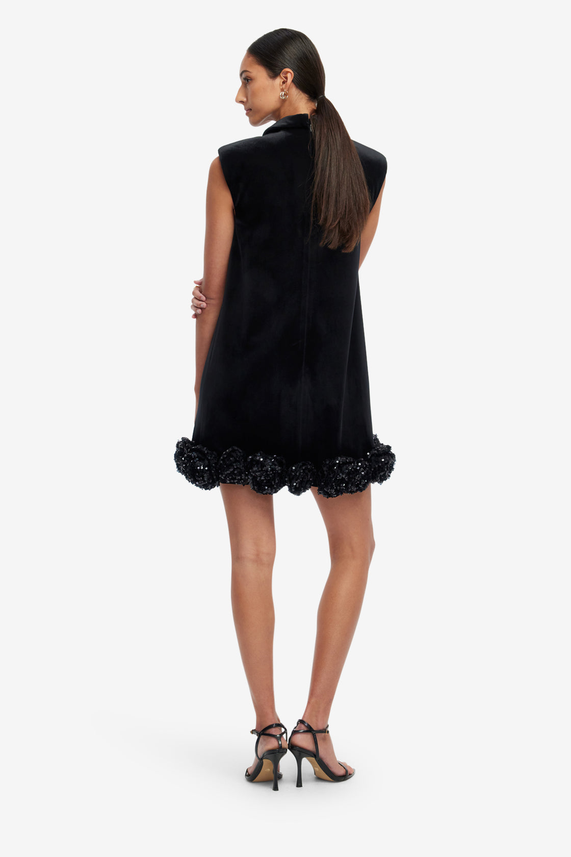 Black dress with floral details on a white background