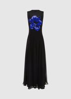 black maxi dress with a round neckline and embellished floral motif, with a fitted waistline and A-line maxi skirt.