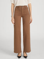 Person wearing brown pants on a white background