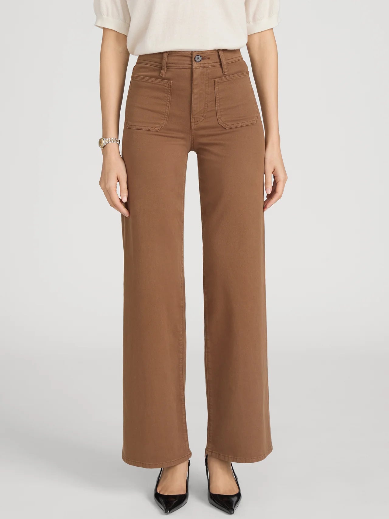 Person wearing brown pants on a white background