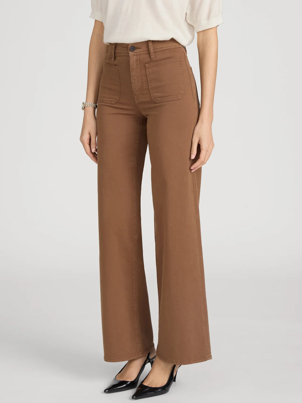 Brown wide-leg pants worn by a person on a light gray background