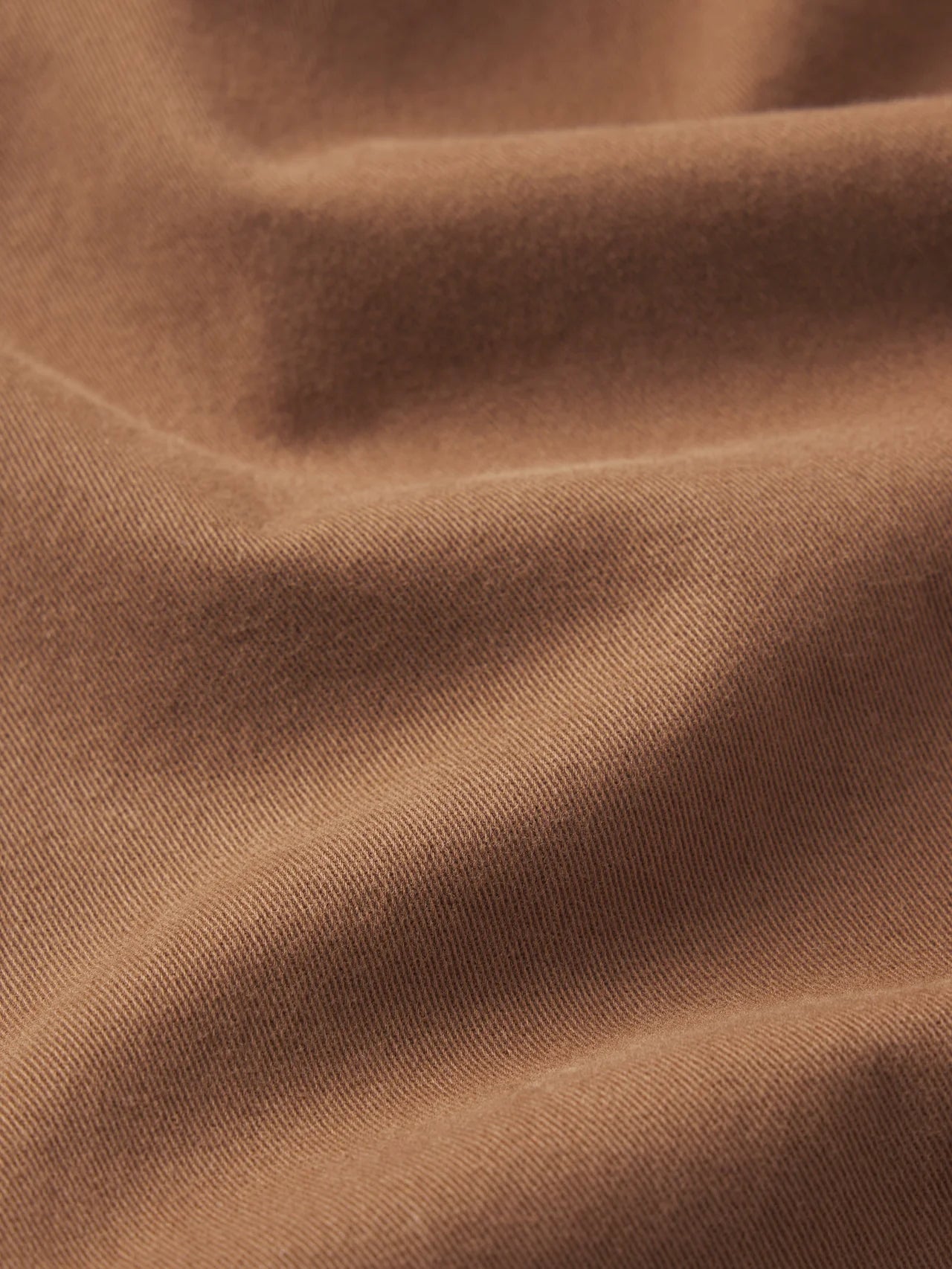 Close-up of brown fabric with visible texture
