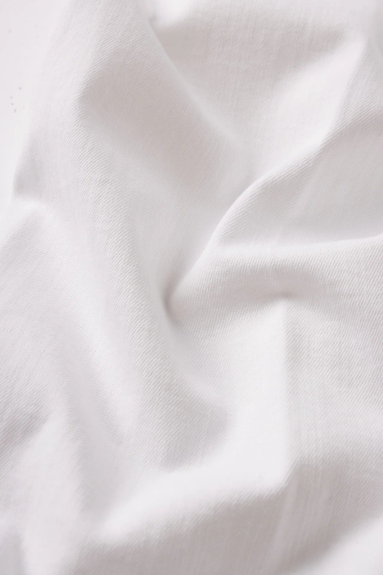 Close-up of white fabric with folds