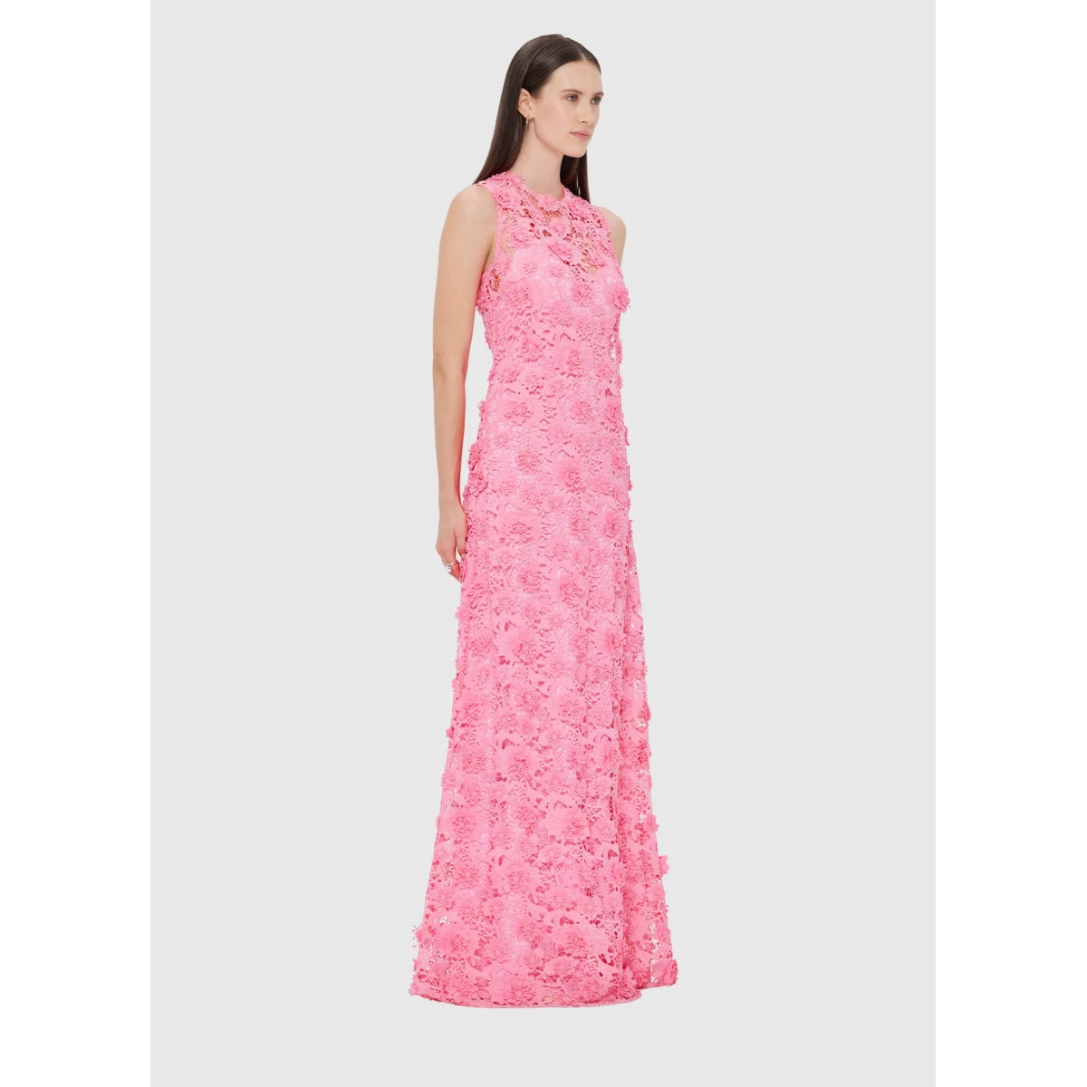 Woman wearing a pink floral dress on a white background