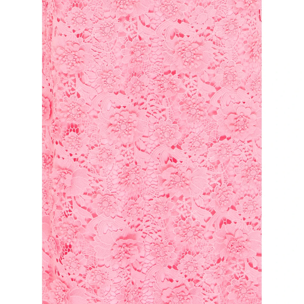 Pink textured paper with lace pattern on a white background