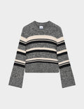 Striped sweater with black, beige, and gray pattern on a light gray background