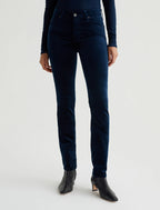 A pair of high-waisted, extended velvet blue jeans with a slim fit and straight legs.