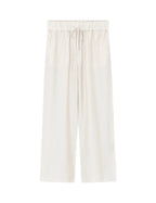 White pants on a light beige background