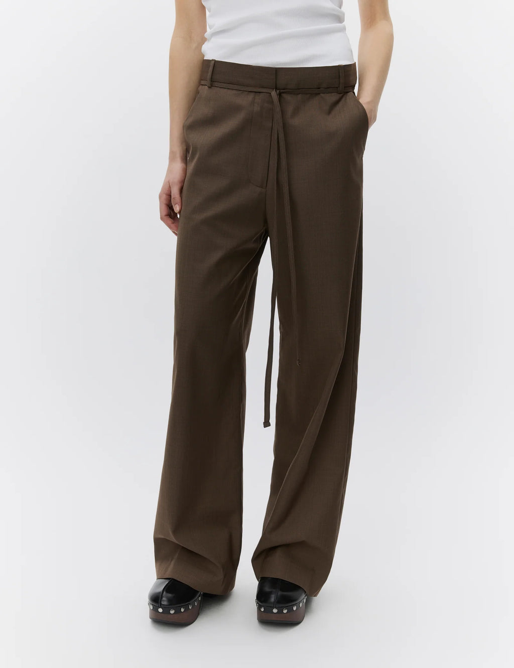 Brown wide-leg pants worn by a person on a white background
