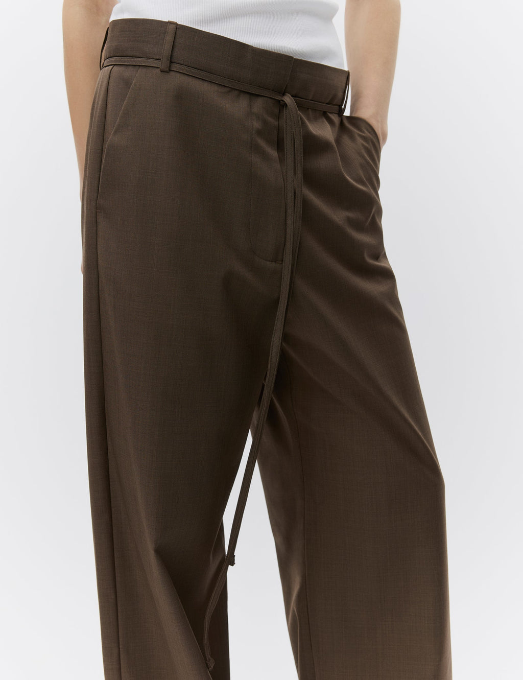 Brown wide-leg pants worn by a person on a white background