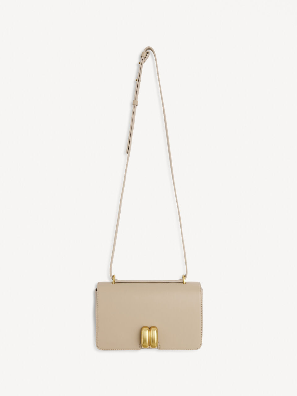 A beige shoulder handbag with a smooth leather finish, featuring a golden motif on the front, a chain shoulder strap, and a zipper closure.