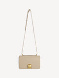 A beige shoulder handbag with a smooth leather finish, featuring a golden motif on the front, a chain shoulder strap, and a zipper closure.