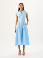 Woman wearing a light blue dress on a white background