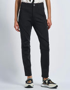 Person wearing black pants with a white background