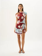 Woman wearing a floral dress on a white background