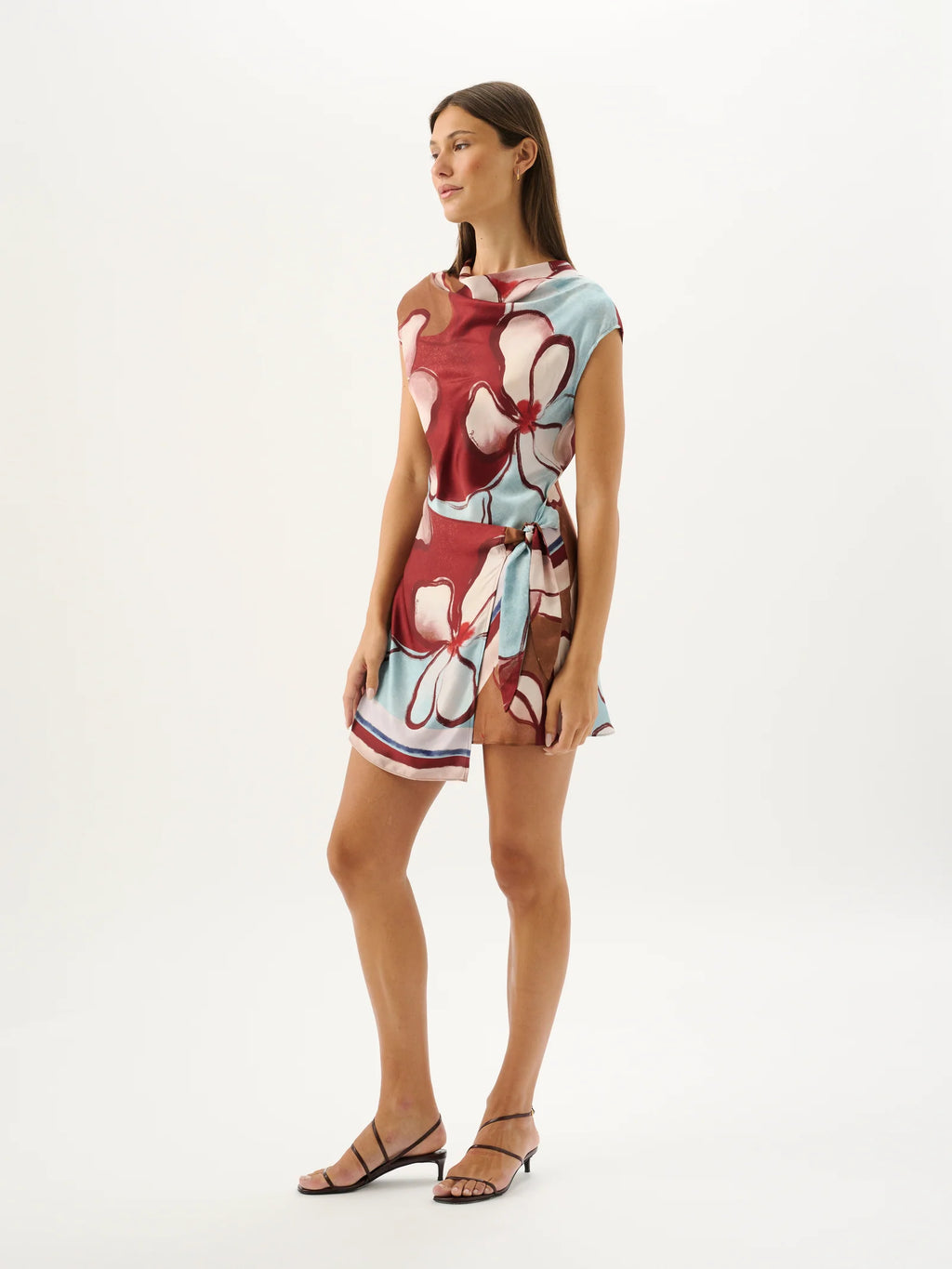 Woman wearing a floral dress on a white background