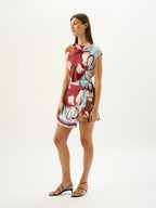 Woman wearing a floral dress on a white background