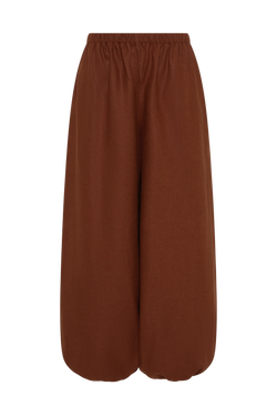 A pair of wide-leg cropped pants in a solid rust brown color, featuring an elastic waistband, shown against a plain white background.