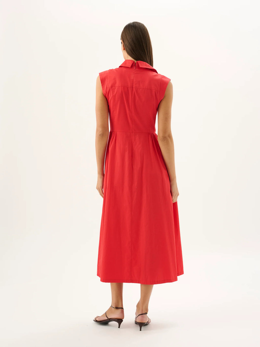 Woman wearing a red dress on a white background