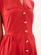 Red dress with gold buttons on a white background