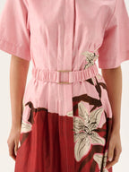 Pink and red dress with floral patterns on a white background