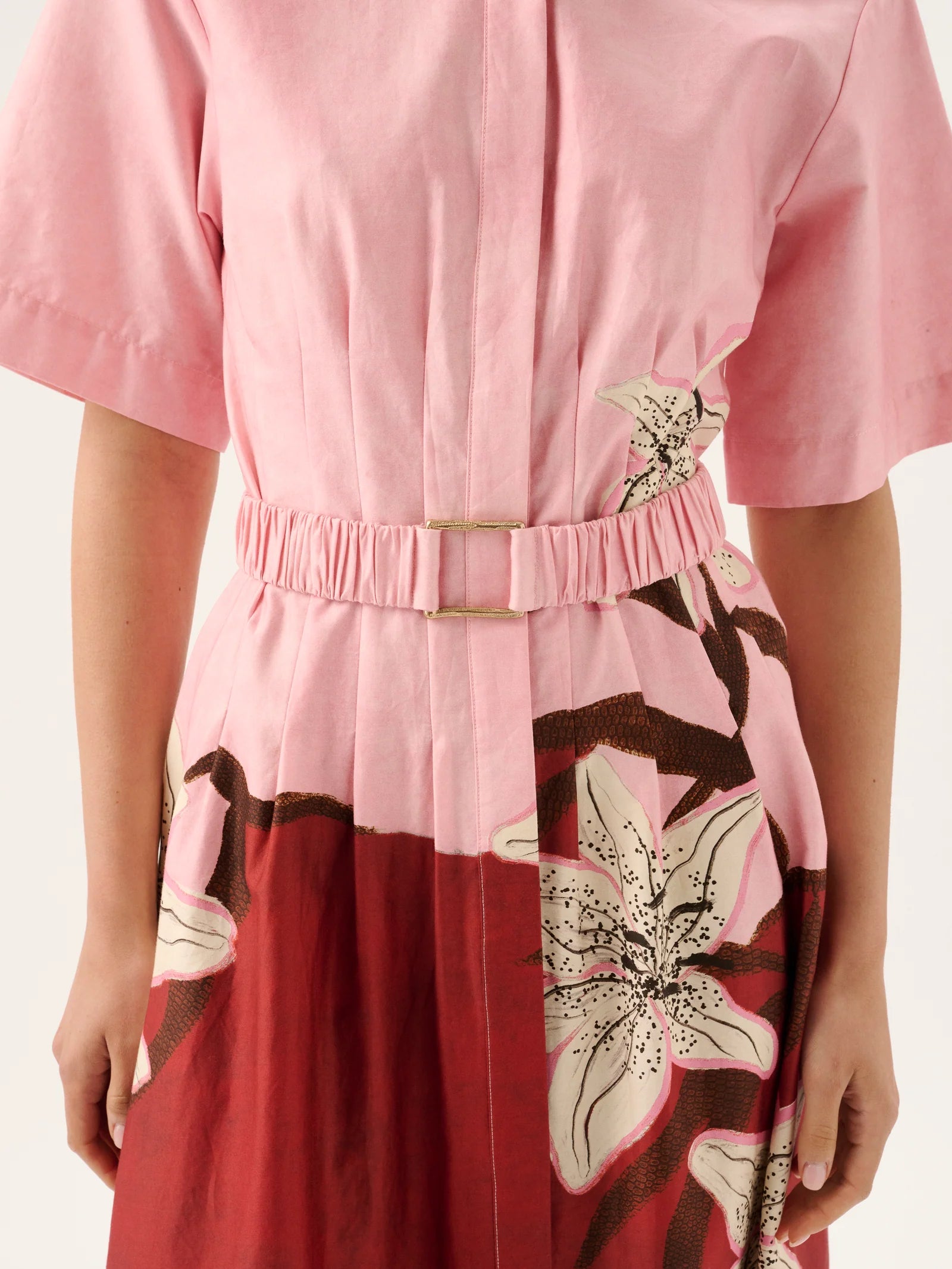 Pink and red dress with floral patterns on a white background