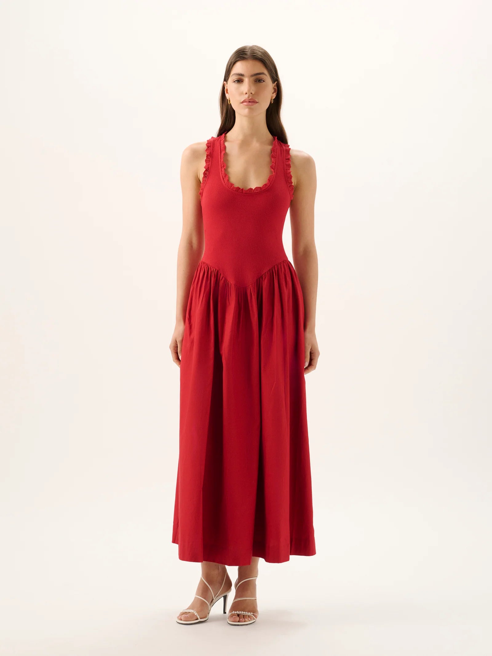 Woman wearing a red dress on a white background