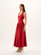 Woman wearing a red dress on a white background