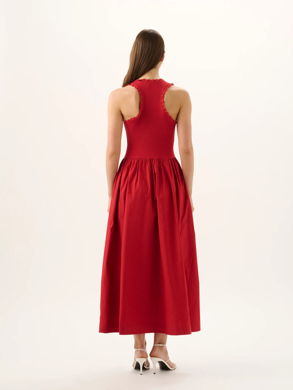 Red dress worn by a model on a white background