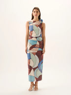 Woman wearing a patterned dress on a white background