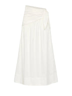 An off-white midi skirt with an asymmetrical draped waist and a side tie detail, shown against a light gray background.