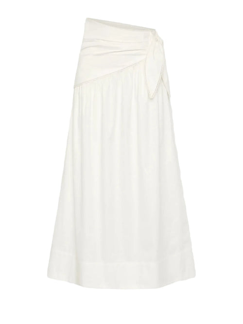 An off-white midi skirt with an asymmetrical draped waist and a side tie detail, shown against a light gray background.