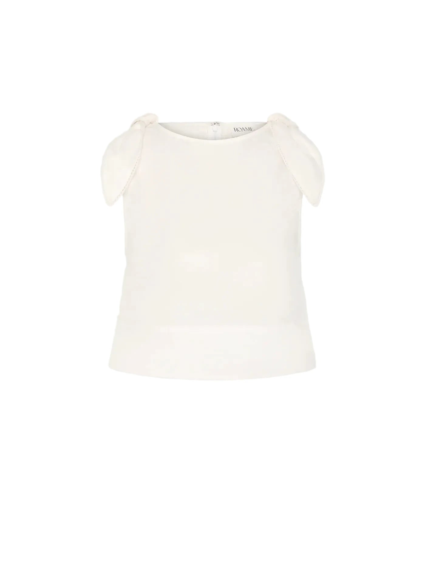 An off-white sleeveless top with delicate shoulder tie details, displayed against a solid light gray background.