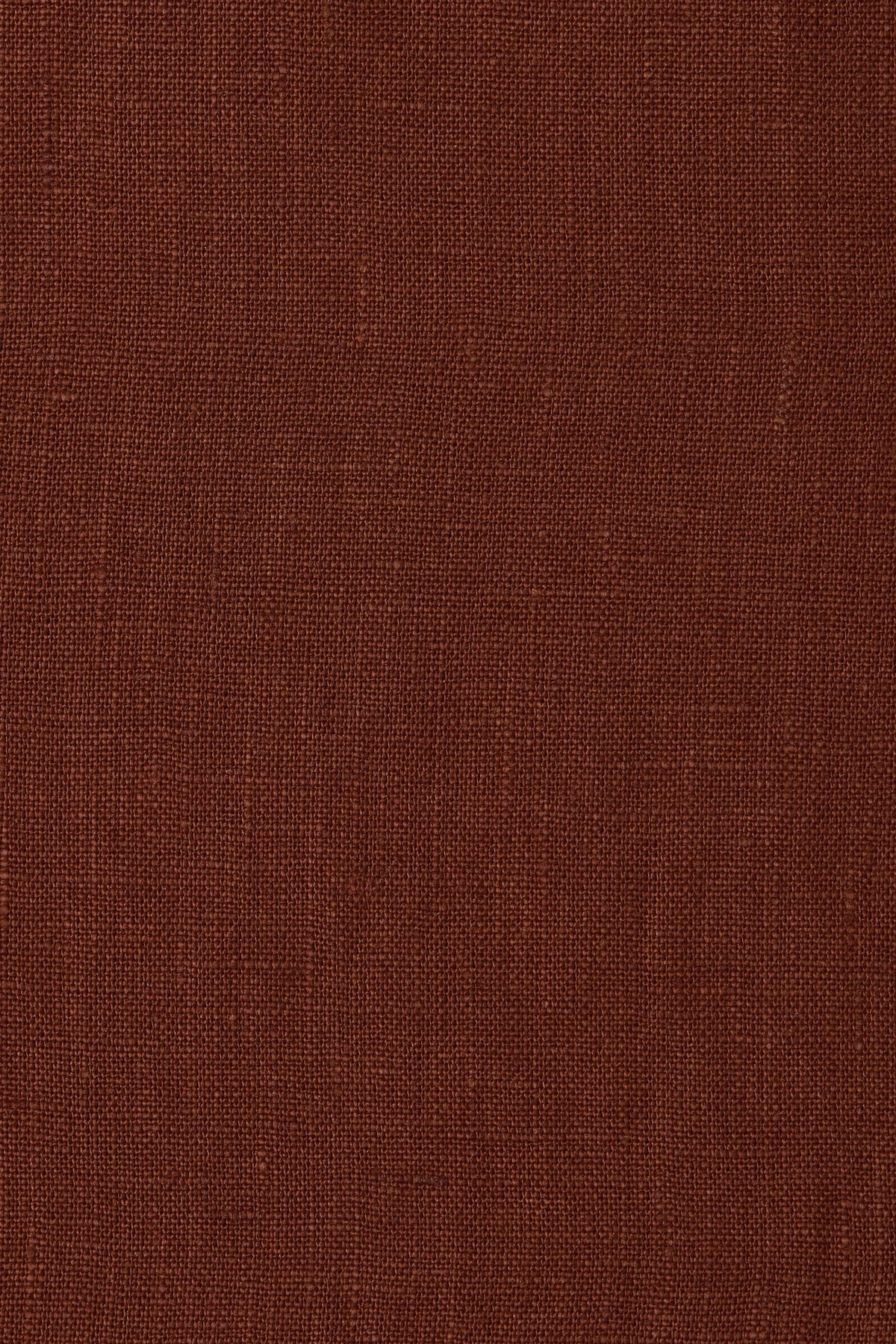 A close-up of a textured brown fabric surface with a fine woven pattern.