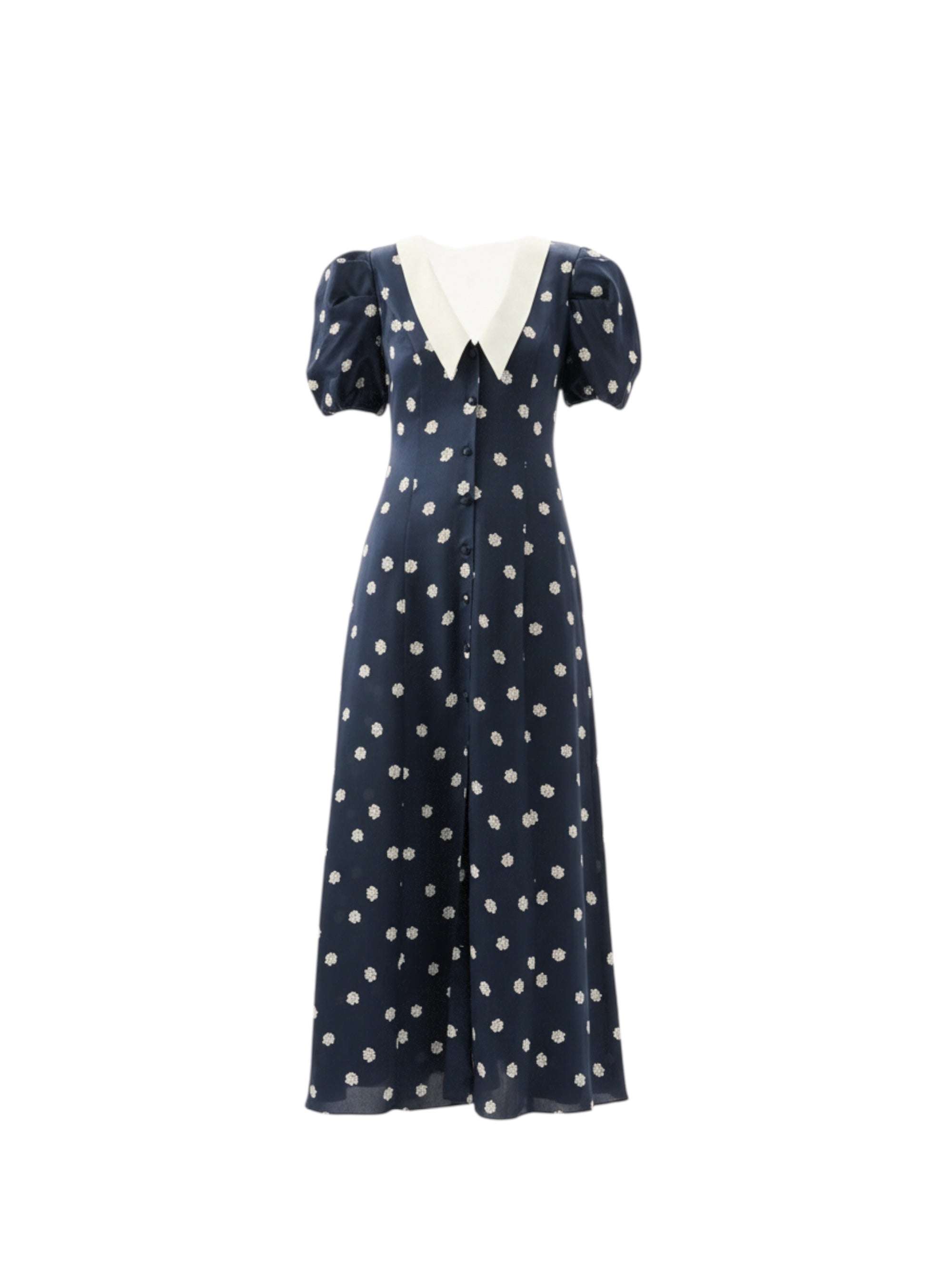 Navy dress with white polka dots on a white background