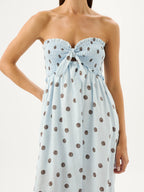 Light blue strapless dress with brown polka dots on a white background