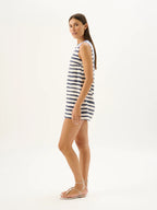 Woman wearing a striped dress on a white background