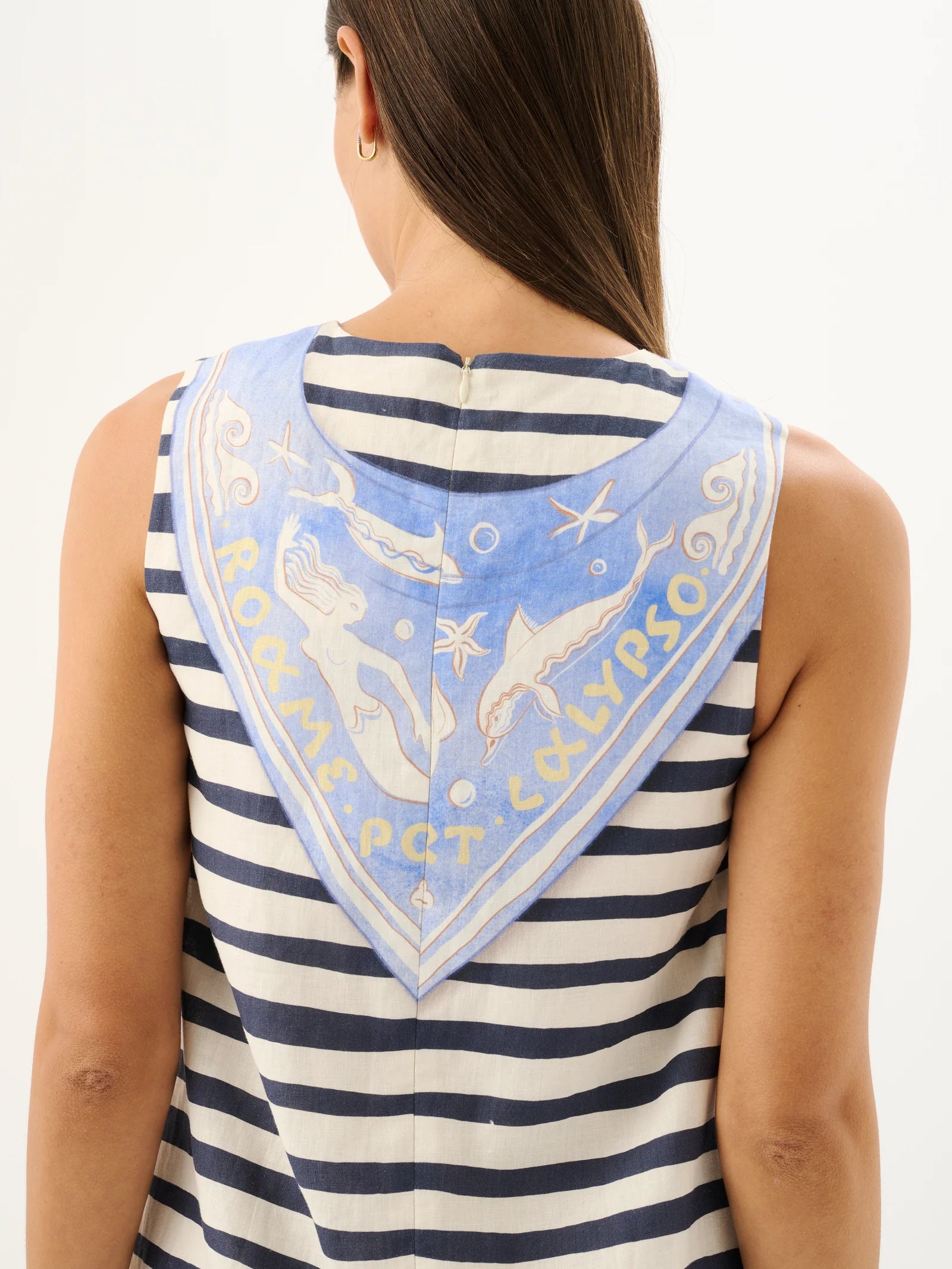 Woman wearing a striped tank top with a decorative bandana on a white background