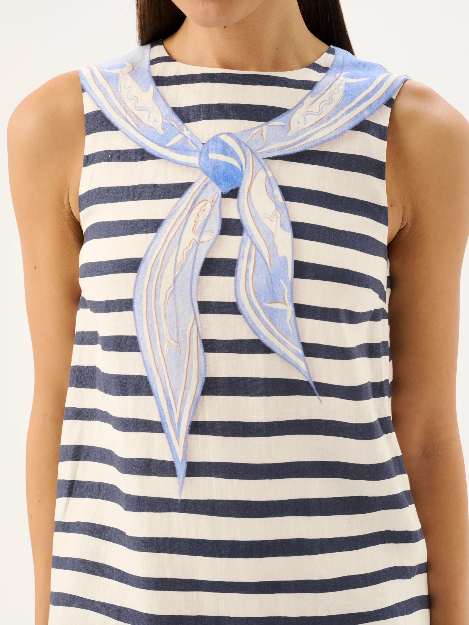 Nautical-themed sleeveless top with striped pattern and blue accents