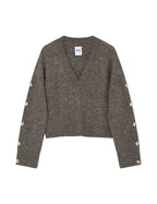 Gray sweater with button details on a white background